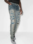 Amiri PJ Thrasher Distressed Effect Ripped Jeans in Blue