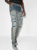 Amiri PJ Thrasher Distressed Effect Ripped Jeans in Blue