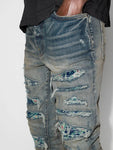 Amiri PJ Thrasher Distressed Effect Ripped Jeans in Blue